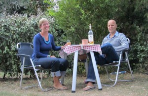 Enjoying a glass of wine under our olive tree at Les Oliviers Camp, Eygalieres